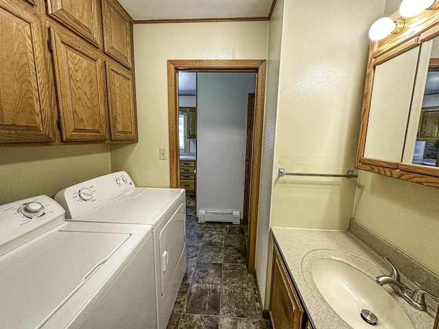 1200 4th Ave N, Park Falls, WI 54552 - laundry area featuring washer and clothes dryer, a baseboard radiator, and stone finish floors