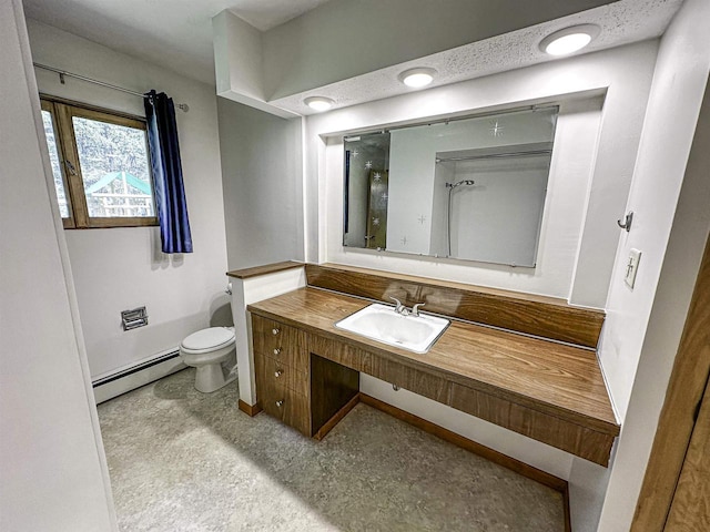 1200 4th Ave N, Park Falls, WI 54552 - full bath featuring a baseboard radiator, toilet, vanity, and baseboards