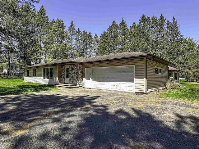 1200 4th Ave N, Park Falls, WI 54552 - view of front facade featuring a garage and driveway