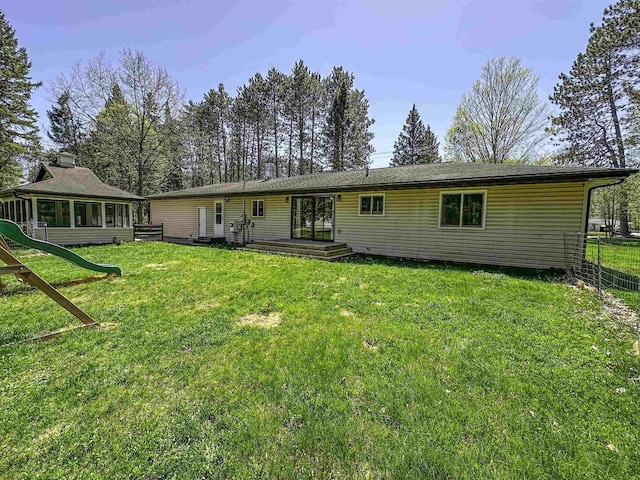 1200 4th Ave N, Park Falls, WI 54552 - rear view of house featuring a sunroom