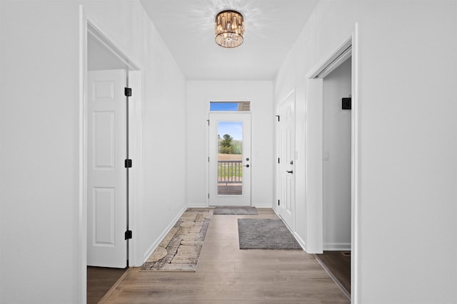 1150 S Bay Shore Rd, Brussels, WI 54204 - hallway featuring a chandelier and wood finished floors