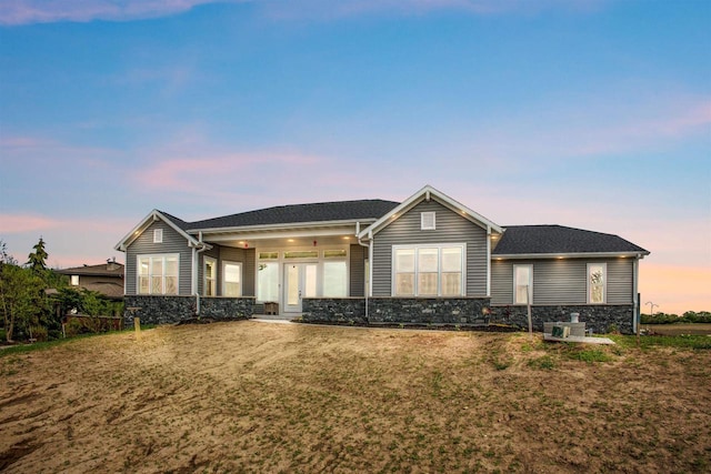 1150 S Bay Shore Rd, Brussels, WI 54204 - single story home featuring stone siding and a yard
