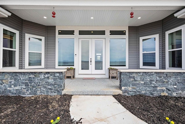 1150 S Bay Shore Rd, Brussels, WI 54204 - view of exterior entry with stone siding and french doors