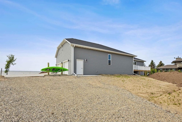 1150 S Bay Shore Rd, Brussels, WI 54204 - rear view of property with a water view and an attached garage