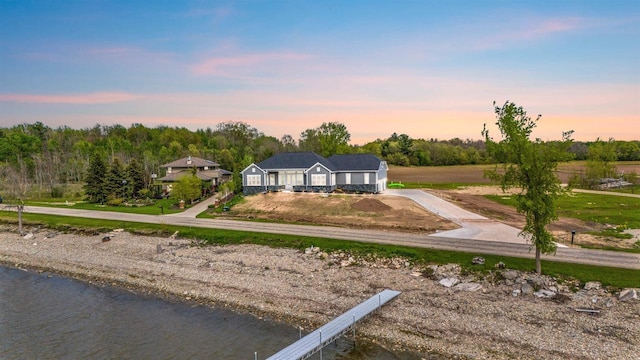 1150 S Bay Shore Rd, Brussels, WI 54204 - back of property at dusk with driveway and a water view