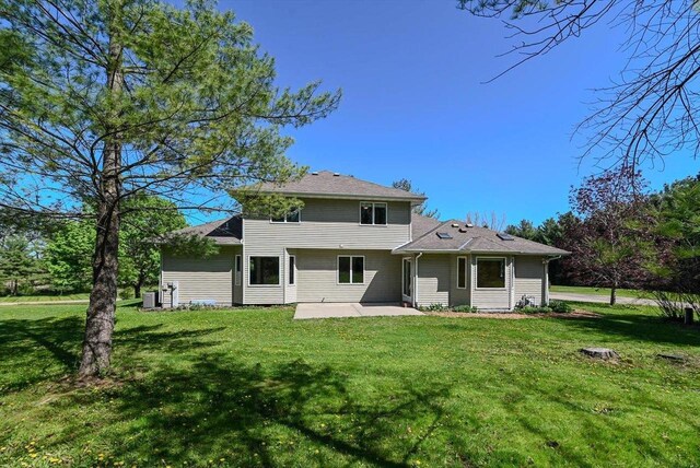6460 Shady Bend Rd, Verona, WI 53593 - rear view of property with a patio, a lawn, and central AC unit