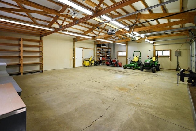 6460 Shady Bend Rd, Verona, WI 53593 - garage with a garage door opener and a ceiling fan