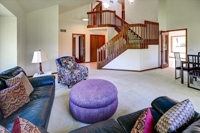 6460 Shady Bend Rd, Verona, WI 53593 - living area with carpet, stairs, high vaulted ceiling, and baseboards