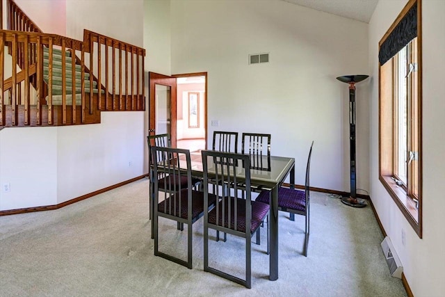 6460 Shady Bend Rd, Verona, WI 53593 - carpeted dining room with baseboards and high vaulted ceiling