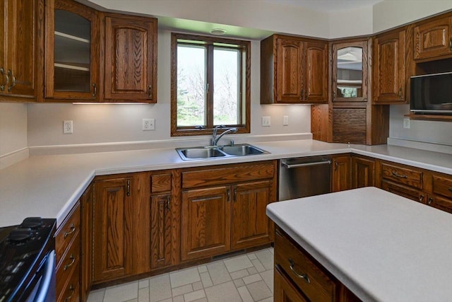 6460 Shady Bend Rd, Verona, WI 53593 - kitchen with a sink, black microwave, light countertops, glass insert cabinets, and stainless steel dishwasher