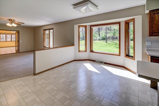 6460 Shady Bend Rd, Verona, WI 53593 - unfurnished dining area featuring baseboards, healthy amount of natural light, and a ceiling fan