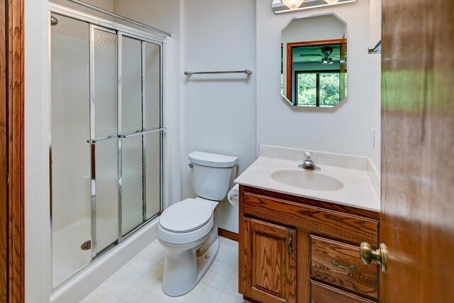6460 Shady Bend Rd, Verona, WI 53593 - full bath featuring a shower stall, vanity, toilet, and tile patterned floors