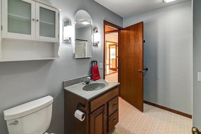 6460 Shady Bend Rd, Verona, WI 53593 - half bathroom featuring toilet, vanity, tile patterned floors, and baseboards