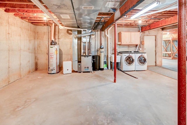 6460 Shady Bend Rd, Verona, WI 53593 - unfinished below grade area with gas water heater, separate washer and dryer, heating unit, a sink, and a water softener system