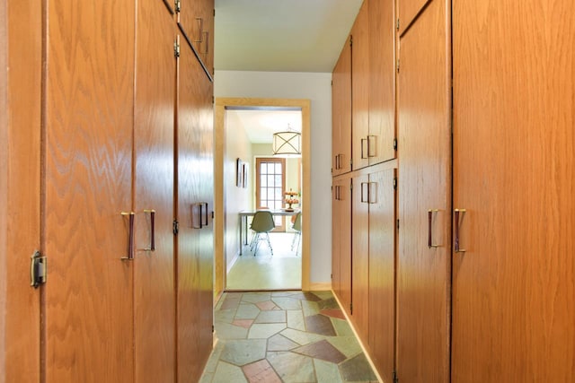 5102 Marathon Dr, Madison, WI 53705 - hallway with light stone finish floors and baseboards