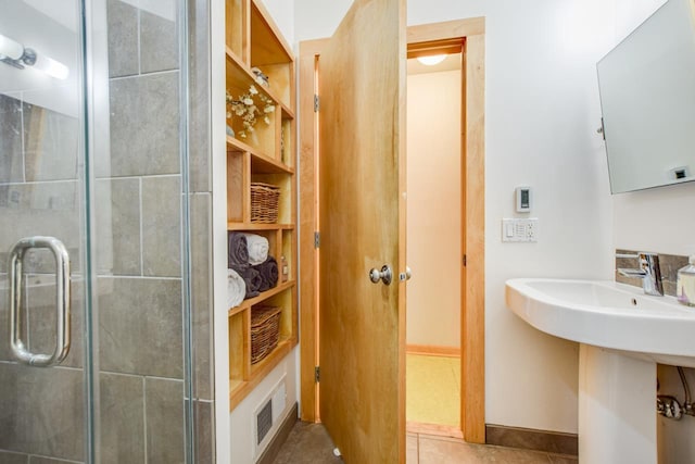 5102 Marathon Dr, Madison, WI 53705 - bathroom featuring a stall shower, tile patterned flooring, and a sink