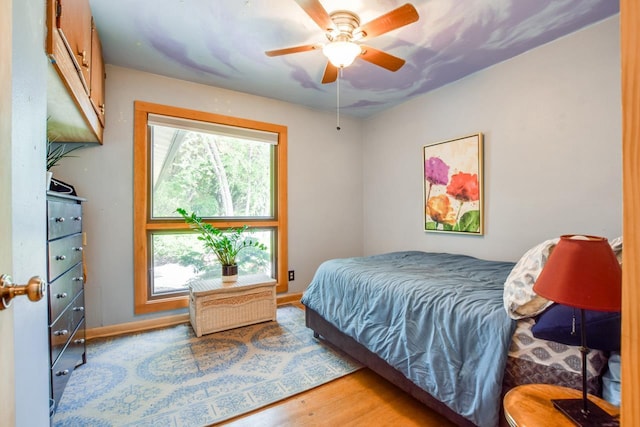 5102 Marathon Dr, Madison, WI 53705 - bedroom with wood finished floors, ceiling fan, and baseboards