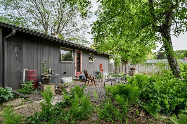 5102 Marathon Dr, Madison, WI 53705 - back of property with a chimney and central AC