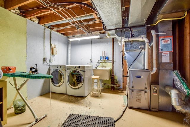 5102 Marathon Dr, Madison, WI 53705 - laundry area with washing machine and dryer and heating unit