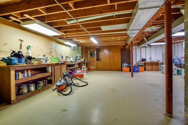 5102 Marathon Dr, Madison, WI 53705 - unfinished below grade area with a workshop area