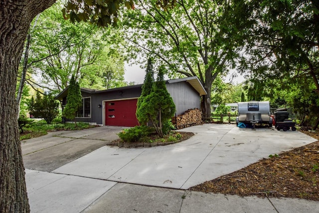 5102 Marathon Dr, Madison, WI 53705 - view of side of property featuring concrete driveway and a garage
