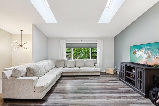 1902 Winfield Dr, Reedsburg, WI 53959 - living area featuring a skylight, a chandelier, and wood finished floors