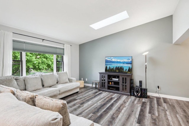 1902 Winfield Dr, Reedsburg, WI 53959 - living room with a skylight, lofted ceiling, wood finished floors, and baseboards