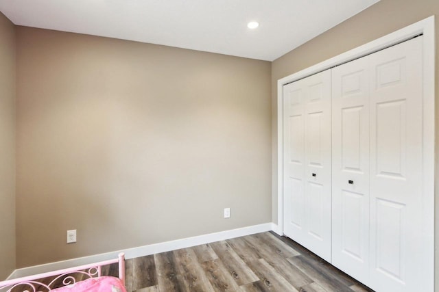 1902 Winfield Dr, Reedsburg, WI 53959 - unfurnished bedroom featuring recessed lighting, wood finished floors, a closet, and baseboards