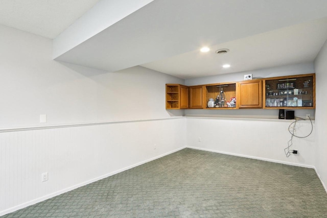 1902 Winfield Dr, Reedsburg, WI 53959 - basement with dark colored carpet, a dry bar, baseboards, and recessed lighting