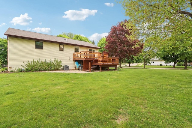 1902 Winfield Dr, Reedsburg, WI 53959 - rear view of house featuring a wooden deck, a lawn, stairs, and cooling unit