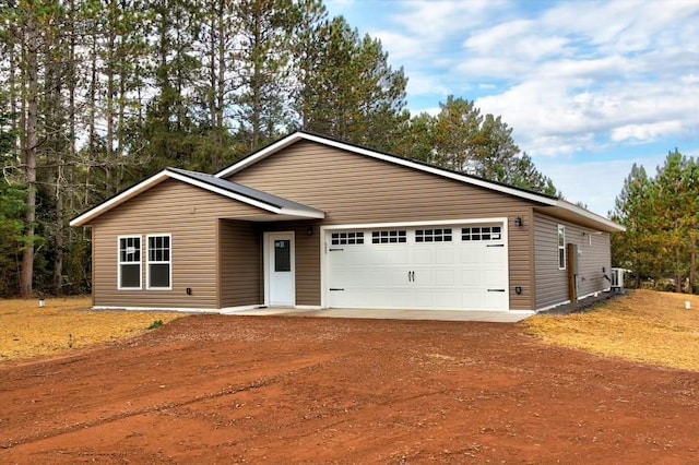 10246 Olker Rd, Hayward, WI 54843 - single story home with dirt driveway and an attached garage