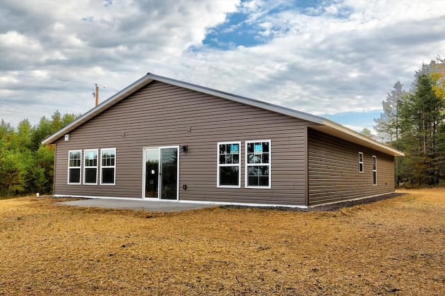 10246 Olker Rd, Hayward, WI 54843 - rear view of house featuring a patio area