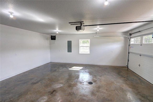10246 Olker Rd, Hayward, WI 54843 - garage with electric panel and a garage door opener