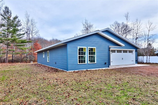 10246 Olker Rd, Hayward, WI 54843 - view of home's exterior with dirt driveway and a garage