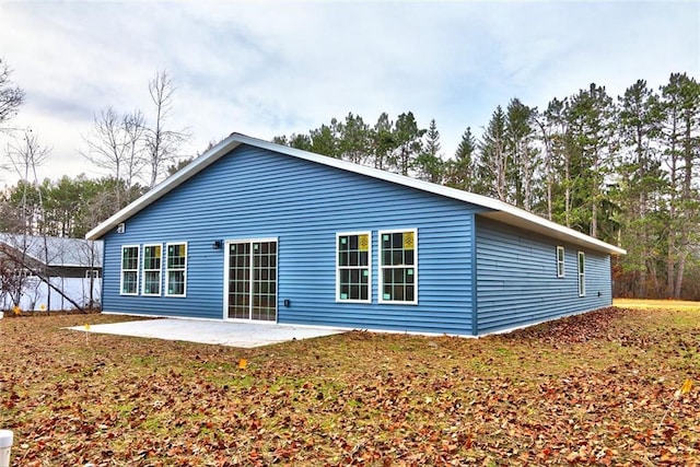 10246 Olker Rd, Hayward, WI 54843 - rear view of house featuring a patio area
