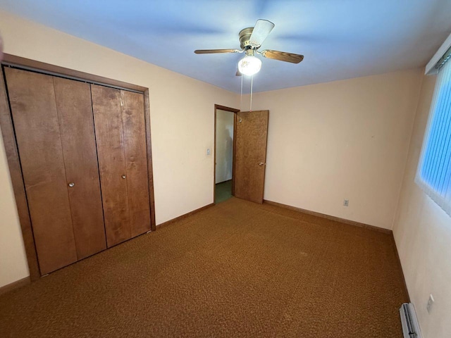W12574 US Highway 45, Marion, WI 54950 - unfurnished bedroom with carpet, a closet, a baseboard radiator, and a ceiling fan