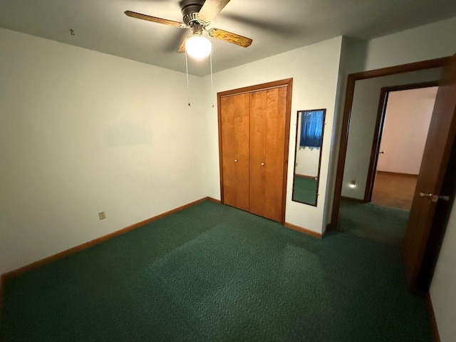 W12574 US Highway 45, Marion, WI 54950 - unfurnished bedroom with a closet, dark colored carpet, baseboards, and ceiling fan