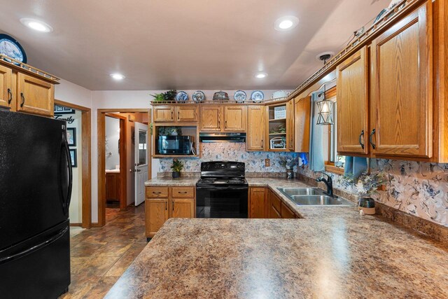 N3154 River Bend Dr, Peshtigo, WI 54157 - kitchen featuring black appliances, under cabinet range hood, a sink, brown cabinetry, and recessed lighting