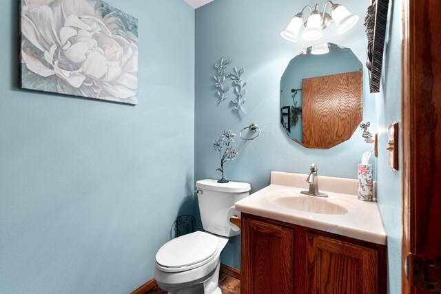 N3154 River Bend Dr, Peshtigo, WI 54157 - half bathroom with toilet, vanity, and baseboards