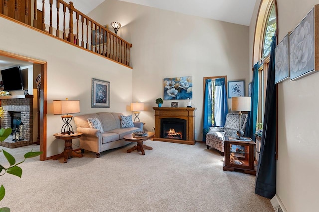N3154 River Bend Dr, Peshtigo, WI 54157 - living area with a warm lit fireplace, carpet flooring, a high ceiling, and baseboards