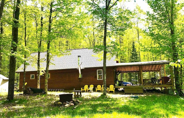 1458 Woodlawn Rd, Pickerel, WI 54465 - back of property with a wooden deck and roof with shingles