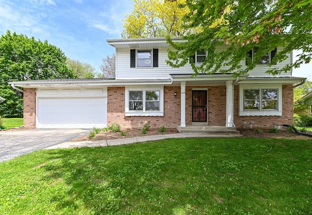 9530 W Debbie Ln, Milwaukee, WI 53224 - view of front of house featuring driveway, a garage, a front yard, and brick siding