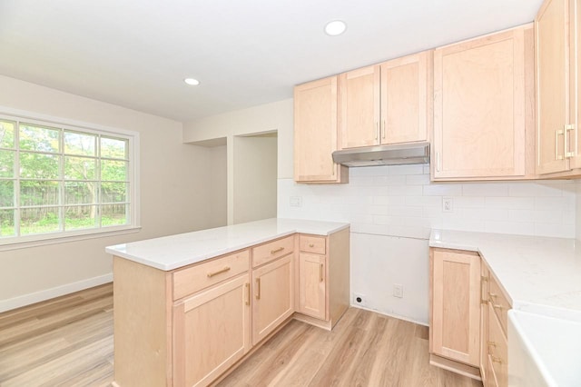 9530 W Debbie Ln, Milwaukee, WI 53224 - kitchen featuring light brown cabinetry, light wood-type flooring, backsplash, under cabinet range hood, and recessed lighting