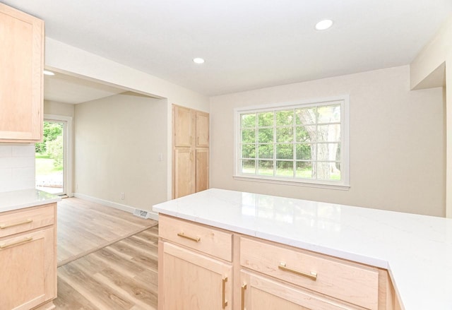 9530 W Debbie Ln, Milwaukee, WI 53224 - kitchen featuring light brown cabinetry, light wood-style floors, healthy amount of natural light, and recessed lighting