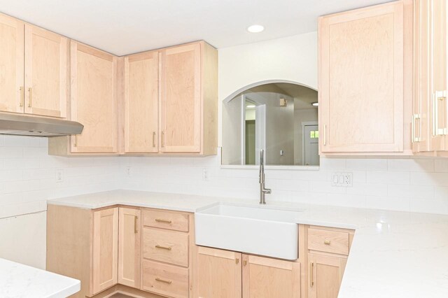 9530 W Debbie Ln, Milwaukee, WI 53224 - kitchen featuring light brown cabinetry, a sink, and backsplash