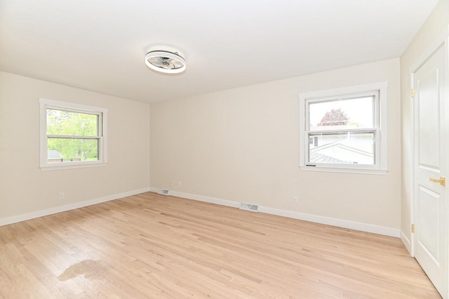 9530 W Debbie Ln, Milwaukee, WI 53224 - unfurnished room featuring light wood-style floors and baseboards