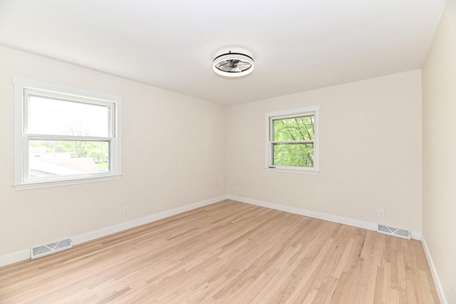 9530 W Debbie Ln, Milwaukee, WI 53224 - spare room with light wood-style flooring and baseboards