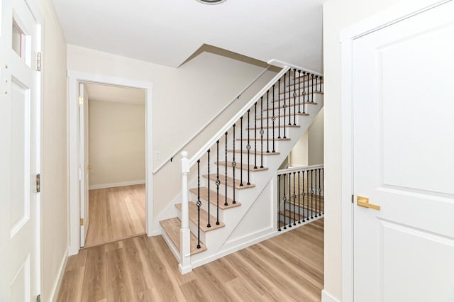 9530 W Debbie Ln, Milwaukee, WI 53224 - stairway featuring wood finished floors and baseboards