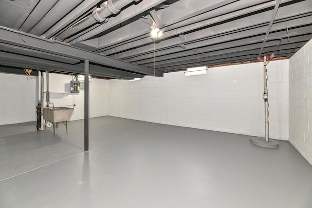 9530 W Debbie Ln, Milwaukee, WI 53224 - unfinished basement featuring a sink, concrete block wall, and electric panel