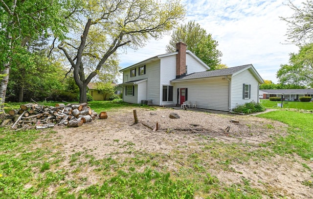 9530 W Debbie Ln, Milwaukee, WI 53224 - back of house with a chimney and cooling unit